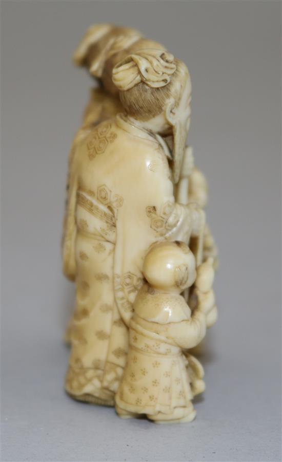 A Japanese ivory okimono of three sages and two attendant children, Meiji period, height 5.9cm